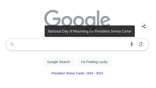 Google search homepage with gray google logo with alt text "National Day of Mourning for President Jimmy Carter" with subtitle text below search bar "President Jimmy Carter, 1924 - 2024"